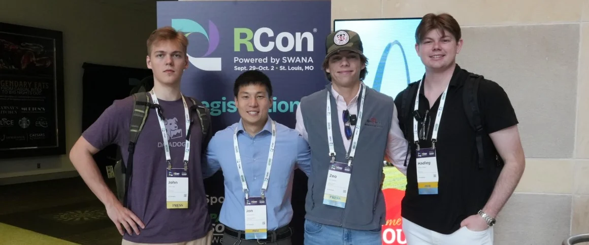 Jonathan Oh with the Bond4 Waste team in front of the RCon conference sign in St. Louis