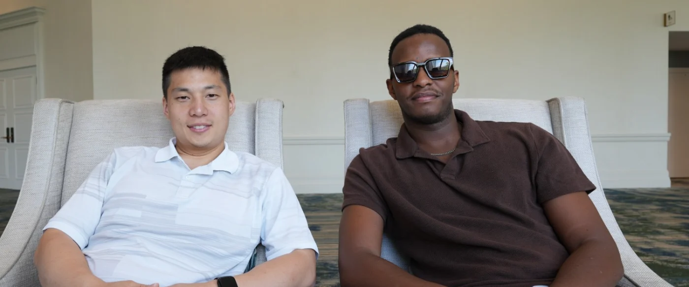 Jonathan Oh with Espoir Kamanzi of Bond4 Waste, seated in armchairs at a conference venue